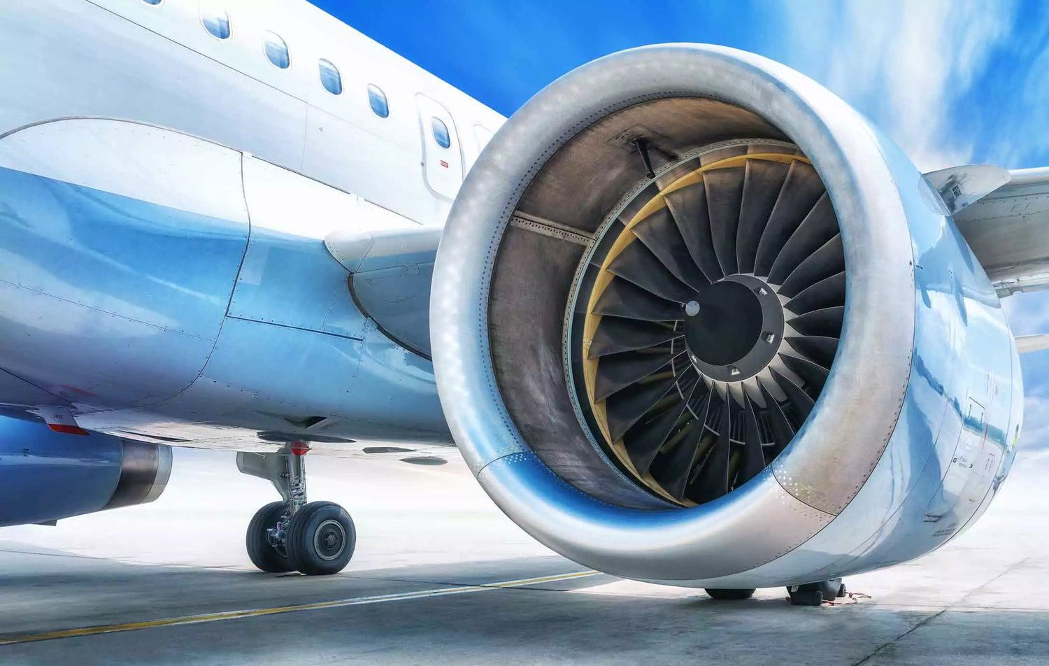 An airplane with a large engine on the tarmac, ensuring clean air.