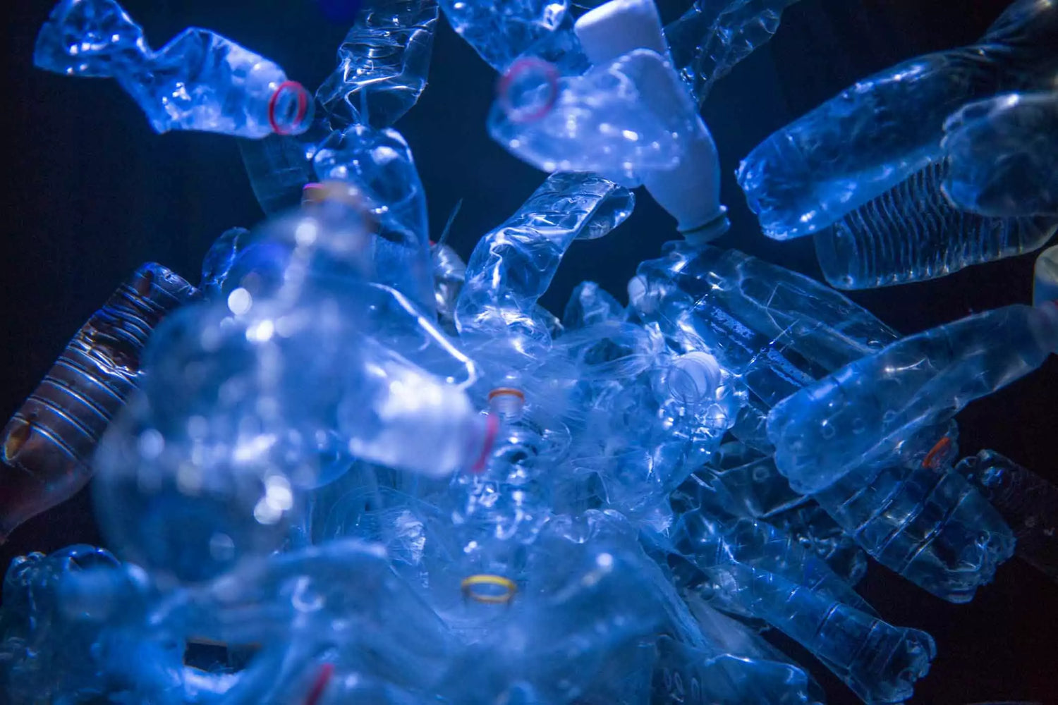 A group of plastic bottles creating a dark room in need of clean air.