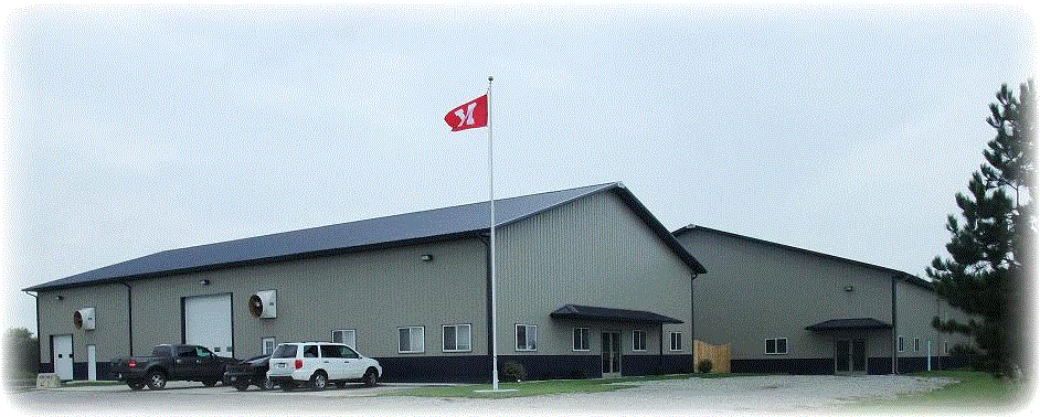 A building with clean air and a car parked in front of it, thanks to an industrial air purifier.