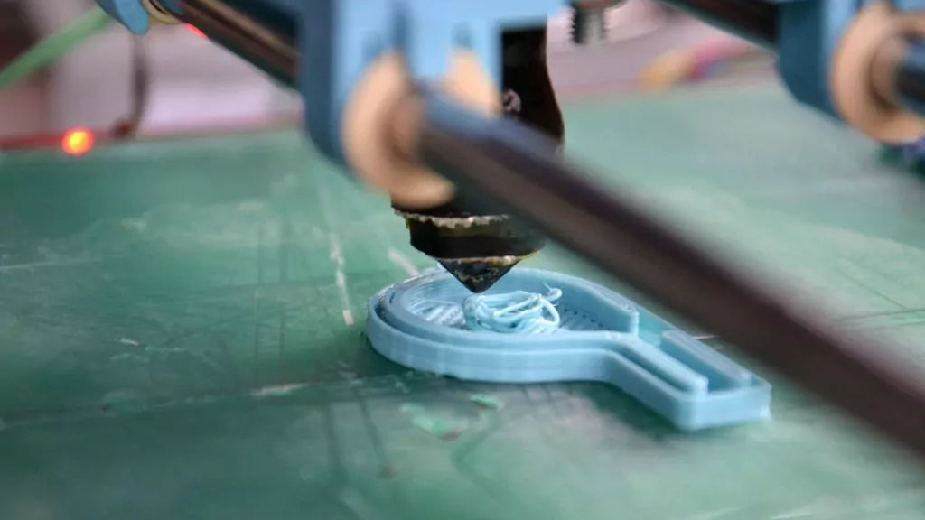 A close-up of a 3d printer in a clean shop air environment using an industrial air purifier.