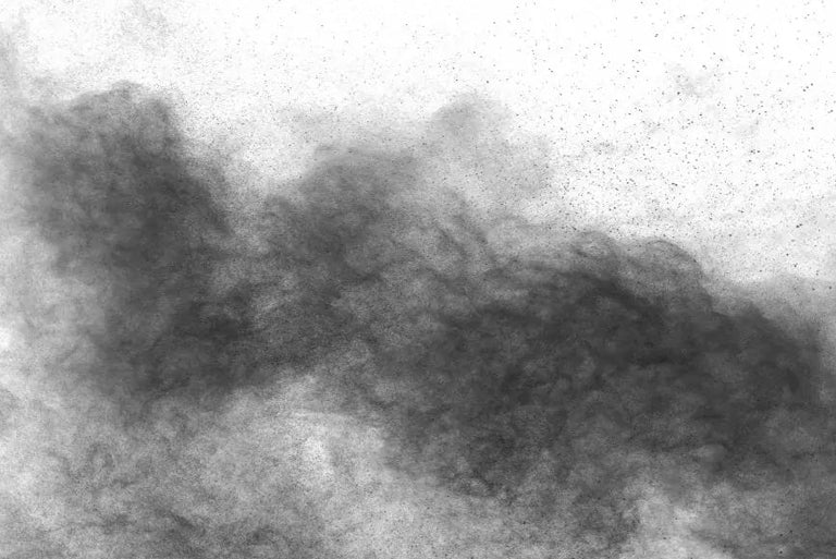 A black and white photo of a cloud of smoke captured in clean shop air.