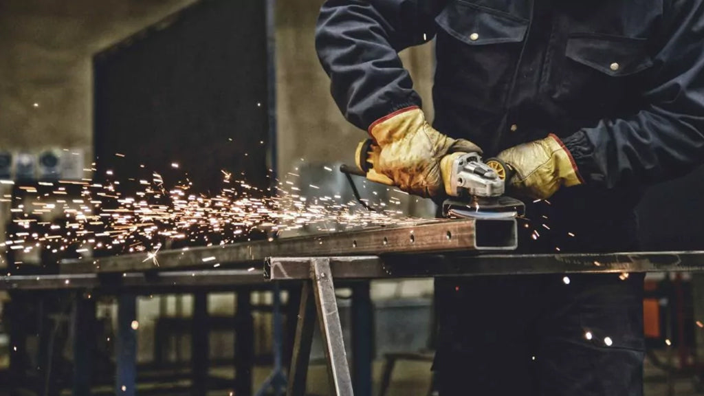 A man working with an industrial air cleaner in a factory to ensure clean shop air.