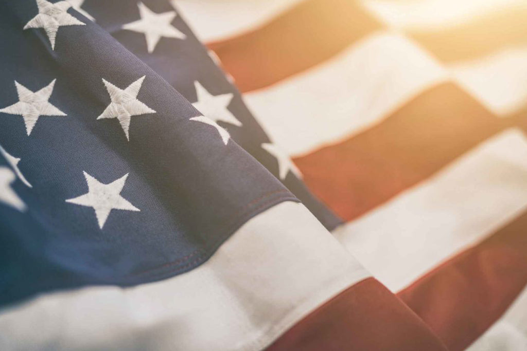 A close up of an American flag in clean air.